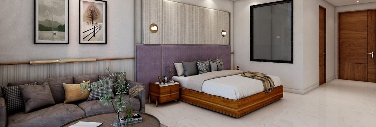 A spacious room featuring a double bed alongside a common seating area. - Namaste Corbett