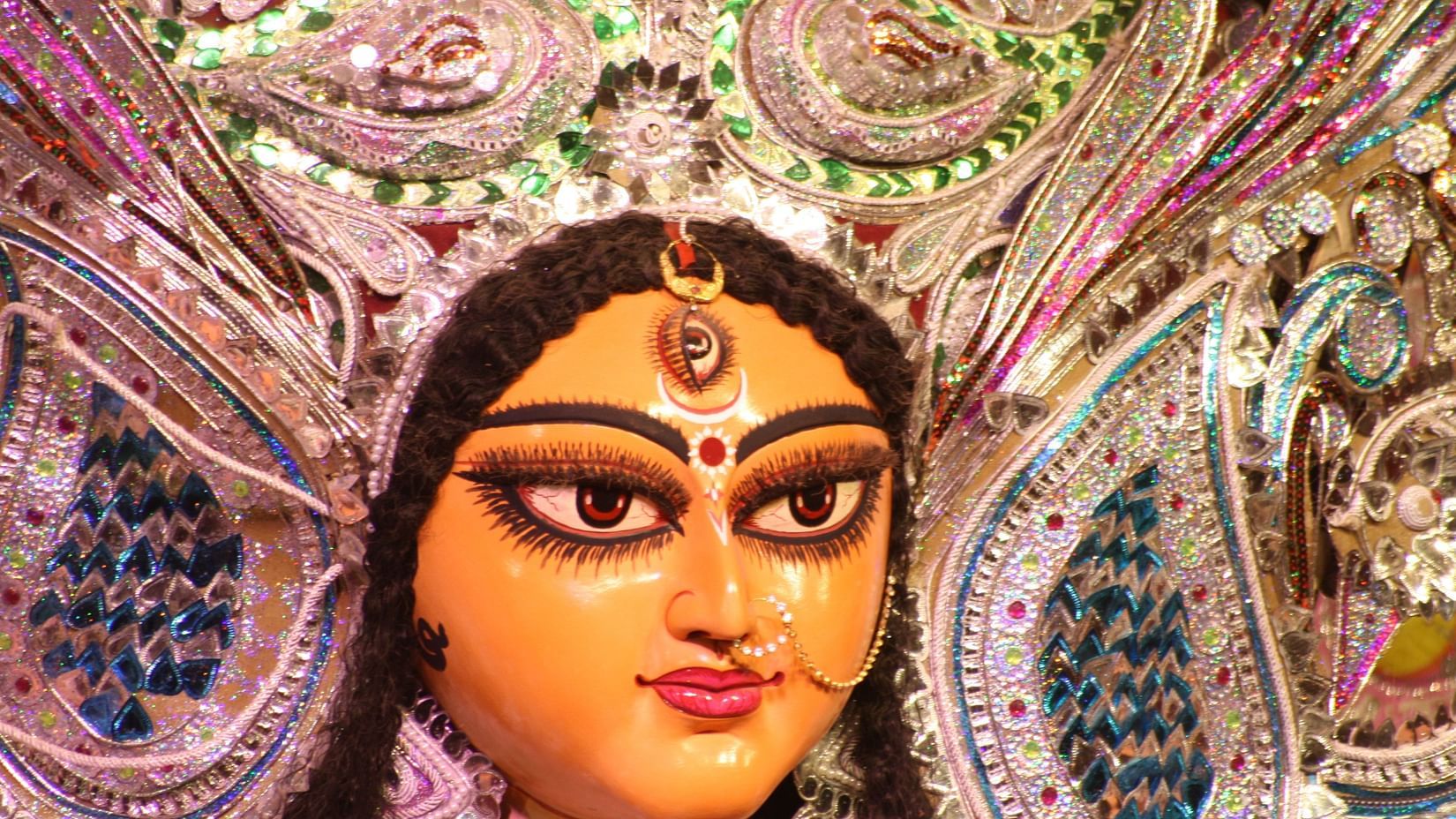 a close-up shot of the face of devi durga