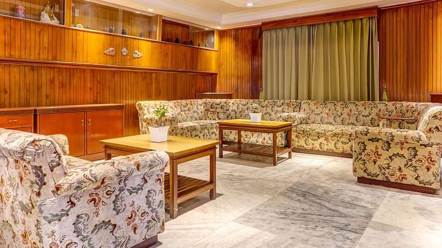 Image of a sitting area with sofas and tables at at Summit Tashi Ghang Heritage Resort, Pelling