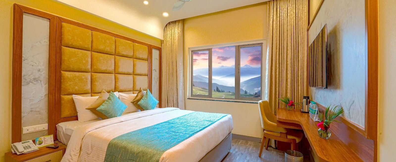 Cozy bedroom with a queen-sized bed, elegant headboard, and large window offering natural light Tara, Comfort Hotel in Hyderabad - Ramoji Film City.