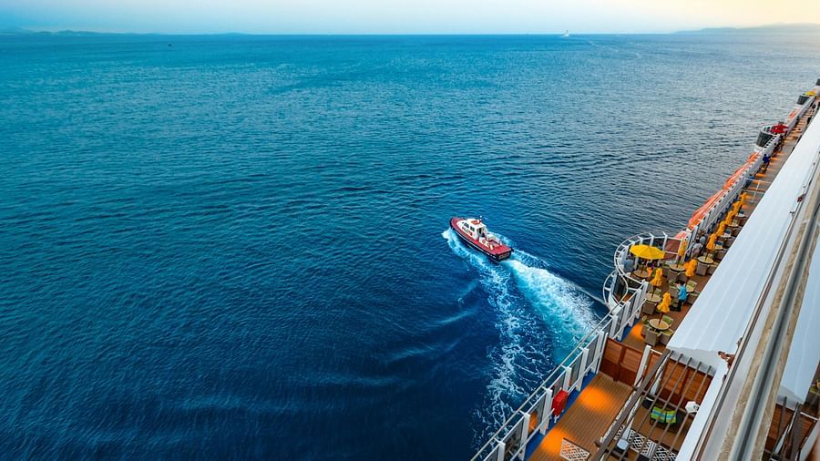 High-angle view through a cruise of people sailing on sea on a boat.