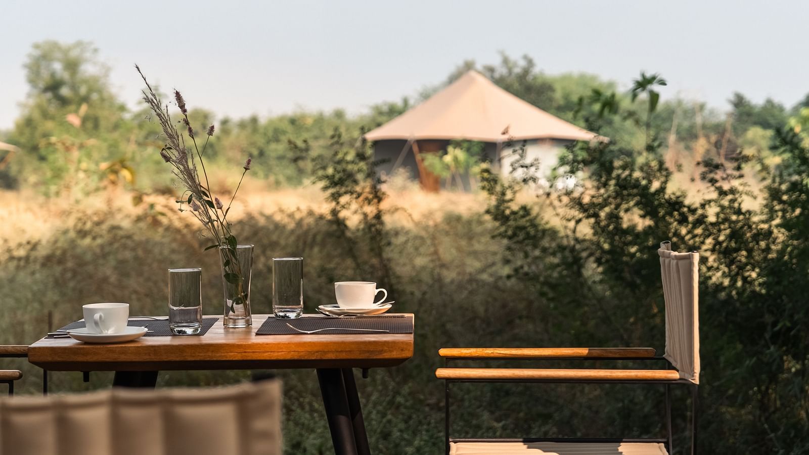 A tea table and a couple of chairs  at Trees N Tigers, Tadoba.