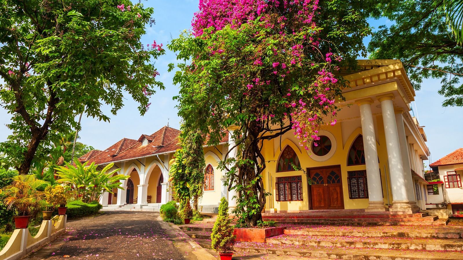 Indo-Portuguese Museum with paper flower trees surrounding the building