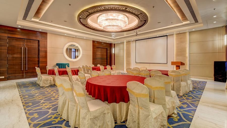 banquet hall with interior design and chairs at The SSK Solitaire Hotel & Banquets, Mumbai Naka - Nashik