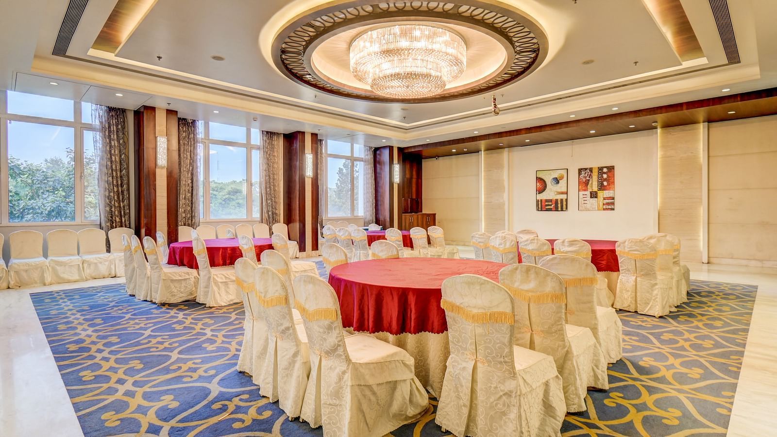 banquet hall with interior design and chairs at The SSK Solitaire Hotel & Banquets, Mumbai Naka - Nashik
