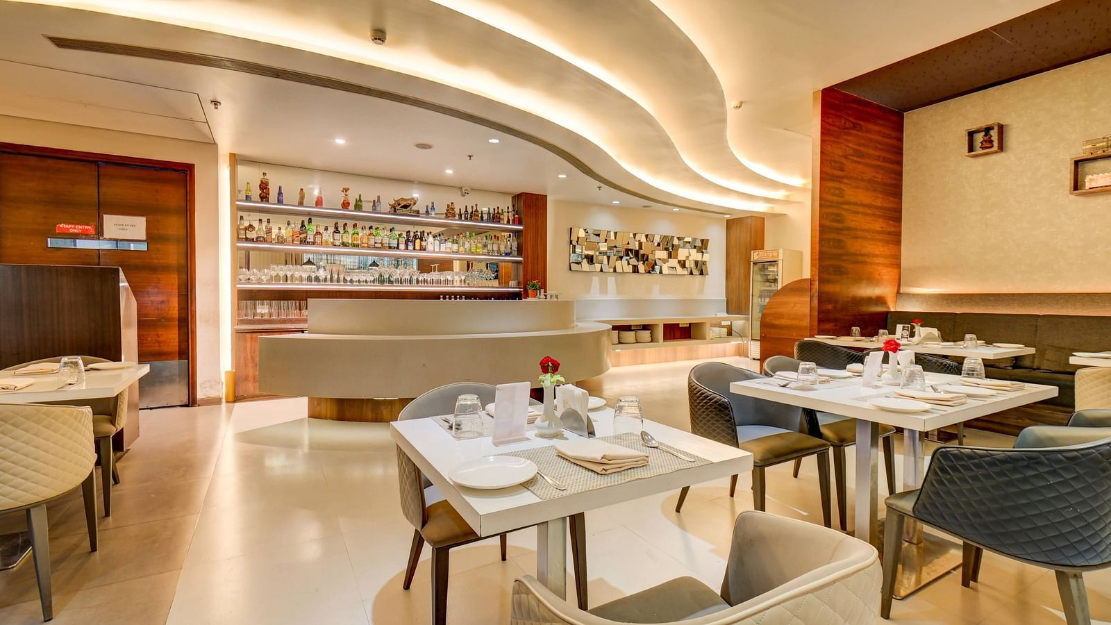 Elegant indoor restaurant dining area of House of Flavour at The SSK Solitaire Hotel & Banquets, Mumbai Naka - Nashik