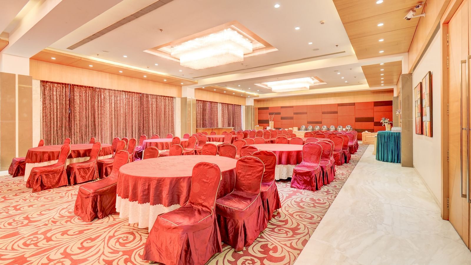 banquet hall with interior design and chairs at The SSK Solitaire Hotel & Banquets, Mumbai Naka - Nashik