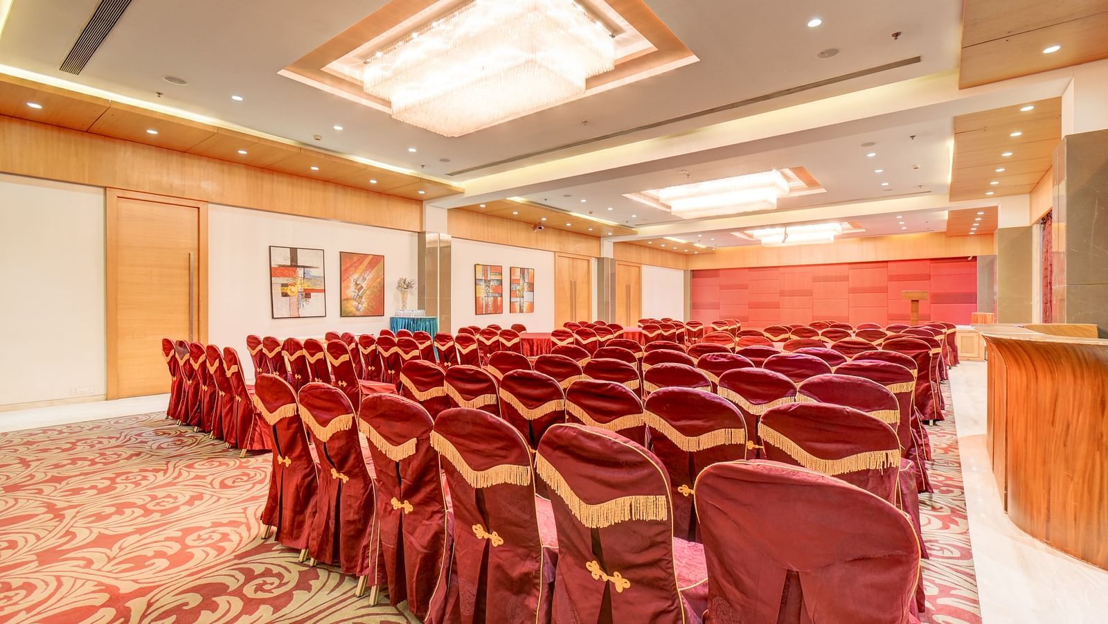 banquet hall with interior design and chairs at The SSK Solitaire Hotel & Banquets, Mumbai Naka - Nashik