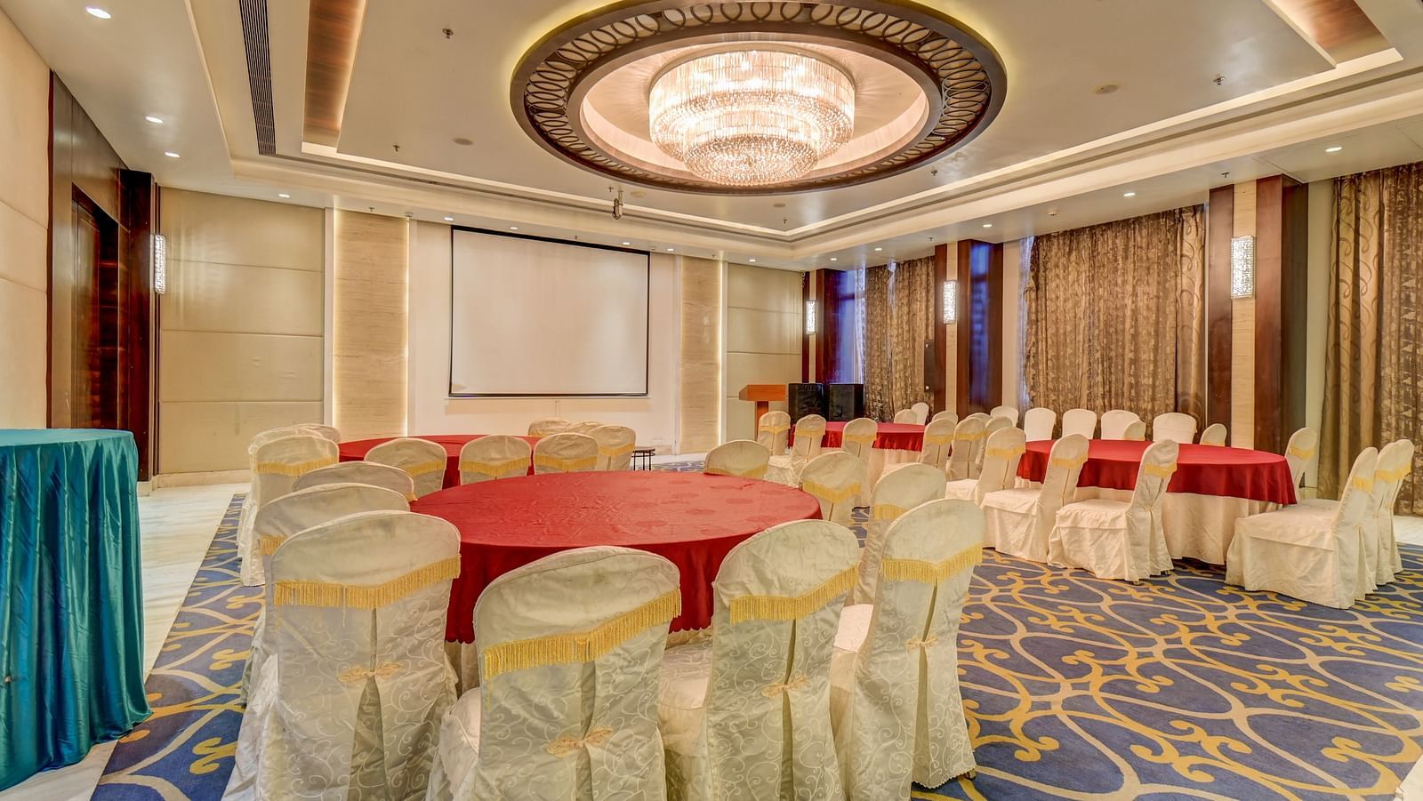 banquet hall with interior design and chairs at The SSK Solitaire Hotel & Banquets, Mumbai Naka - Nashik