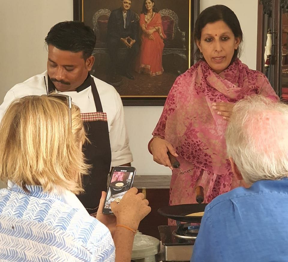 Tourists attending the cooking classes at Dev Shree, Deogarh