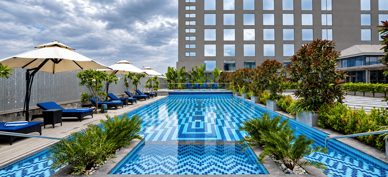 Modern Rooftop Pool Under Cloudy Skies