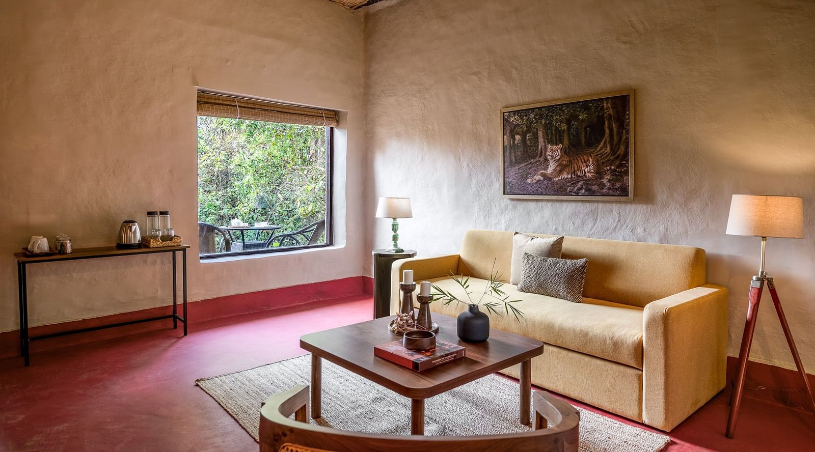 Side view of the sofa in Mud House Suite at Saccharum Safari Lodge, Balaghat