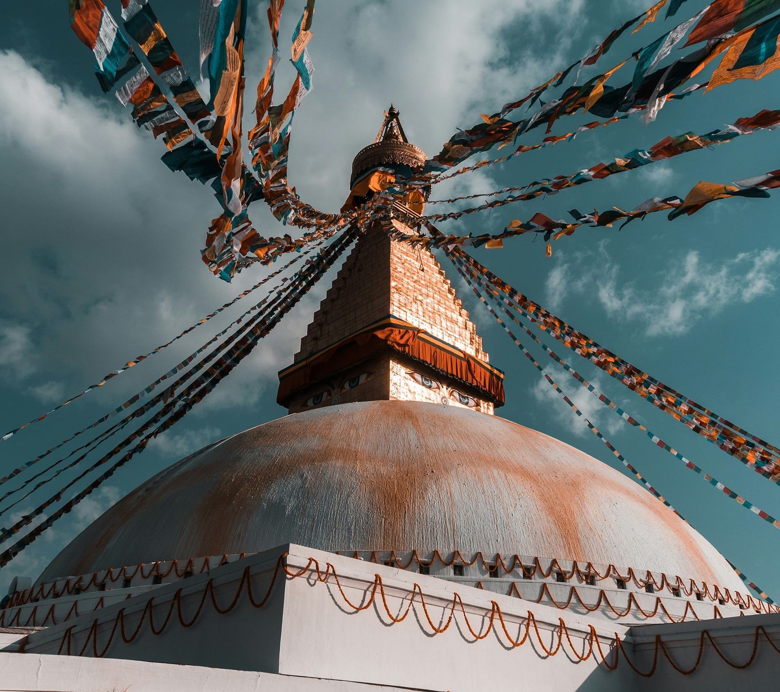 Many stings with coloured piece of cloth hung to the building in Kathmandu.