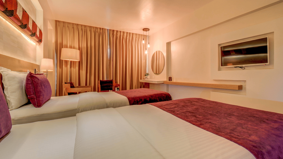 Premium room with twin beds and lavish interiors at The SSK Solitaire Hotel & Banquets, Mumbai Naka - Nashik