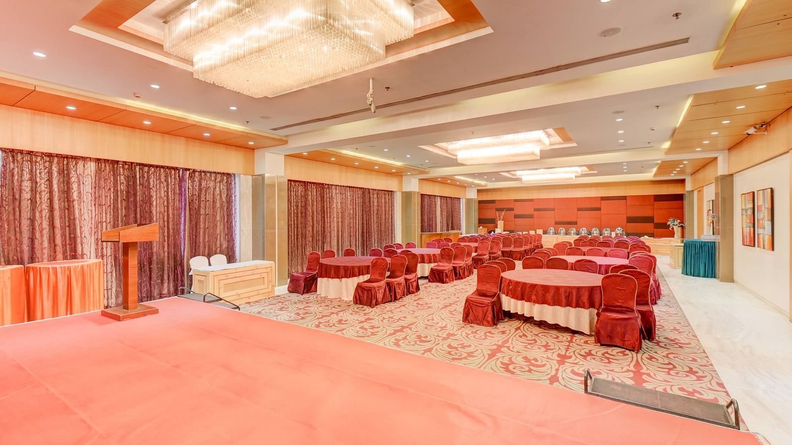 banquet hall with interior design and chairs at The SSK Solitaire Hotel & Banquets, Mumbai Naka - Nashik
