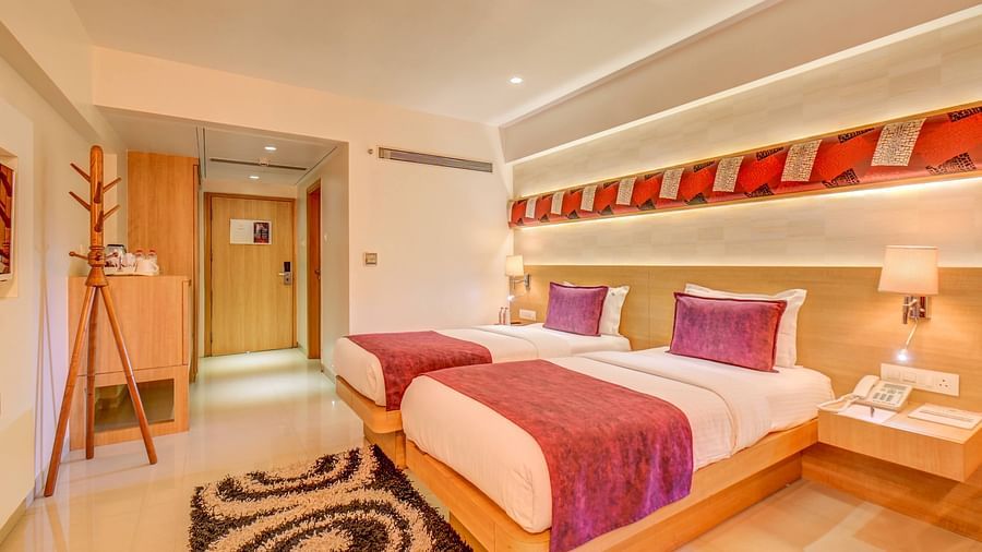 premium room with twin beds and lavish interiors at The SSK Solitaire Hotel & Banquets, Mumbai Naka - Nashik