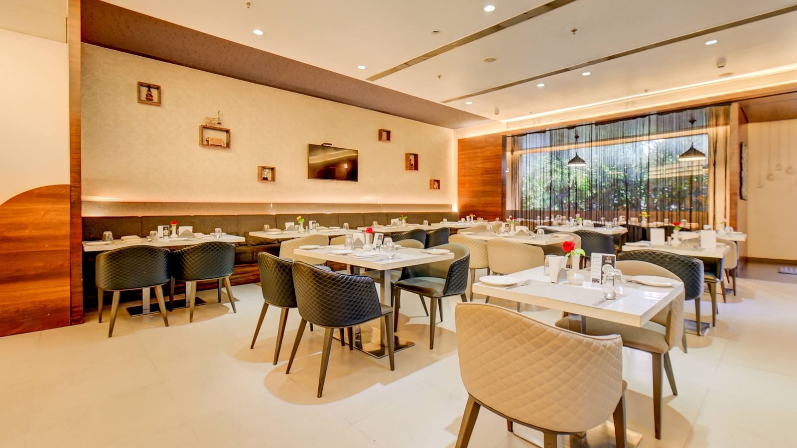 Elegant indoor restaurant dining area of House of Flavour at The SSK Solitaire Hotel & Banquets 