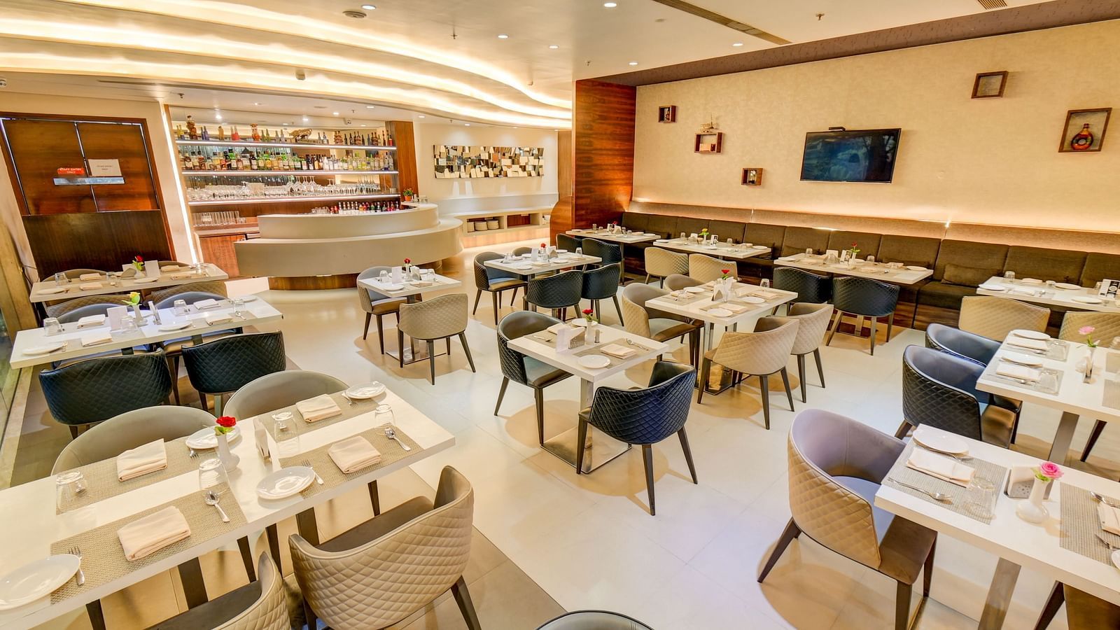Elegant indoor restaurant dining area of House of Flavour at The SSK Solitaire Hotel & Banquets 