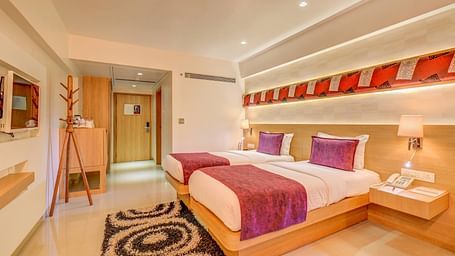 a view of the twin bed at Premium room at The SSK Solitaire Hotel & Banquets, Mumbai Naka - Nashik