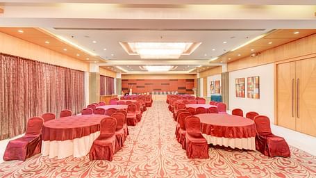 banquet hall with interior design and chairs at The SSK Solitaire Hotel & Banquets, Mumbai Naka - Nashik
