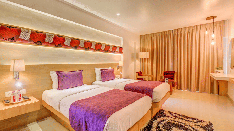 A view of the twin bed at Premium room at The SSK Solitaire Hotel & Banquets, Mumbai Naka - Nashik