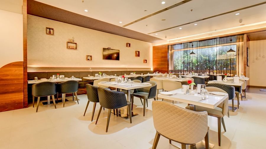 Elegant indoor restaurant dining area of House of Flavour at The SSK Solitaire Hotel & Banquets, Mumbai Naka - Nashik