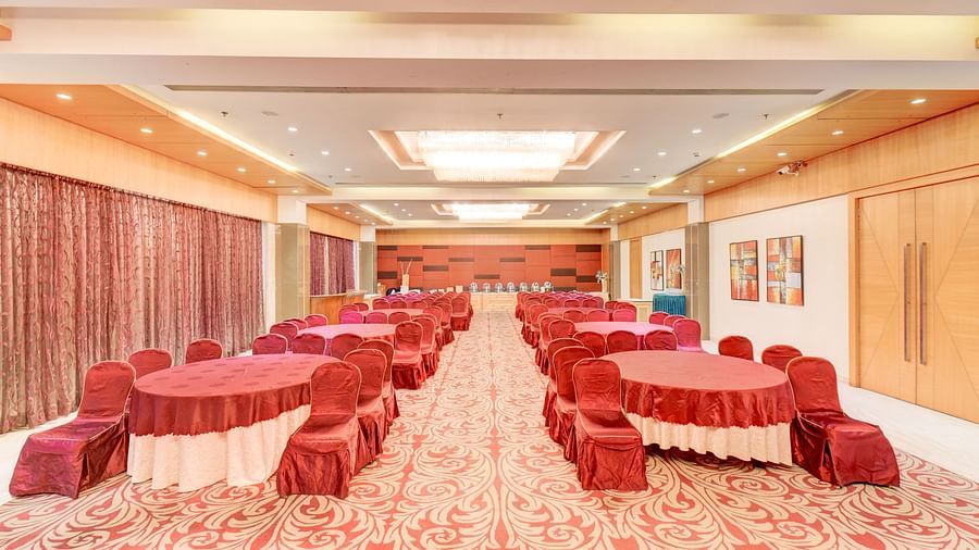 banquet hall with interior design and chairs at The SSK Solitaire Hotel & Banquets, Mumbai Naka - Nashik