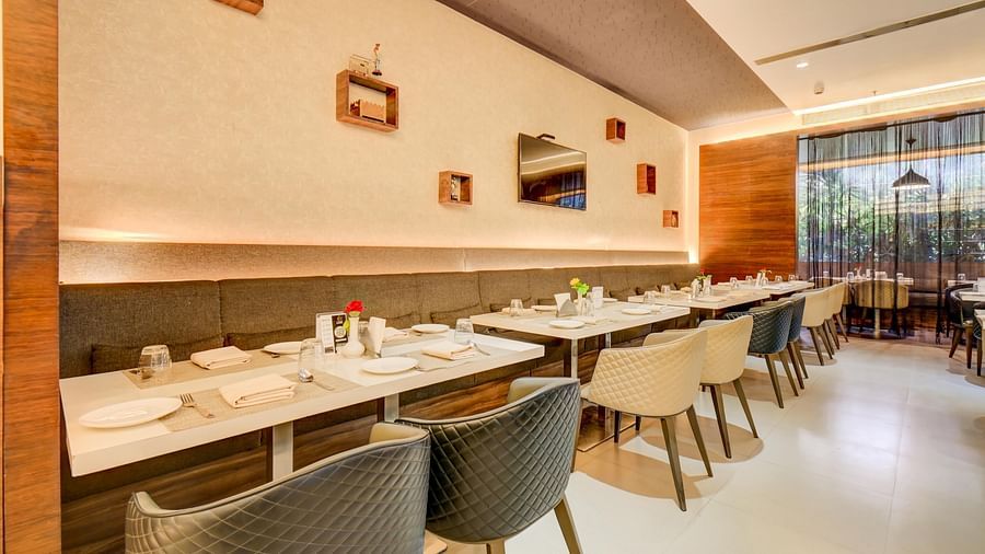 Elegant indoor restaurant dining area of House of Flavour at The SSK Solitaire Hotel & Banquets, Mumbai Naka - Nashik