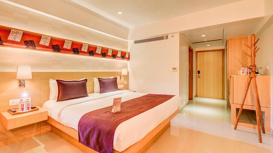 a view of the king sized bed of Deluxe room at The SSK Solitaire Hotel & Banquets, Mumbai Naka - Nashik