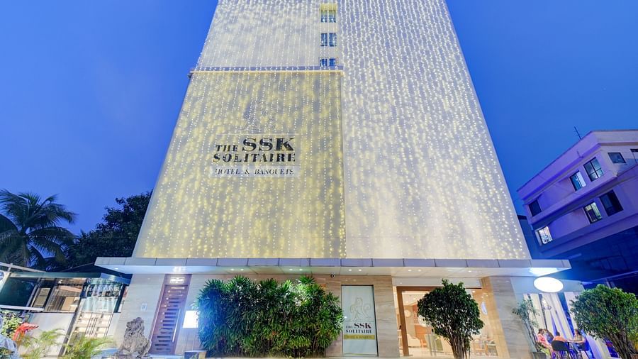 facade image of The SSK Solitaire Hotel & Banquets, Mumbai Naka - Nashik at dusk