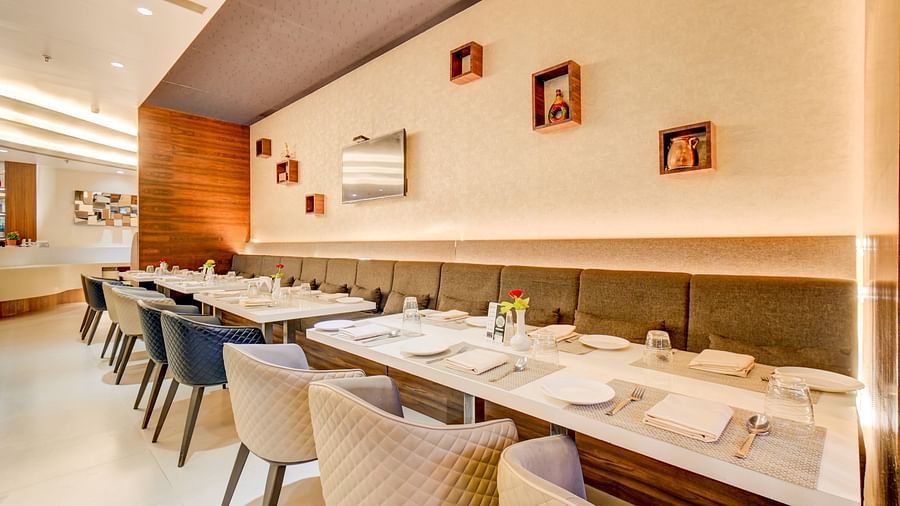 Elegant indoor restaurant dining area of House of Flavour at The SSK Solitaire Hotel & Banquets, Mumbai Naka - Nashik