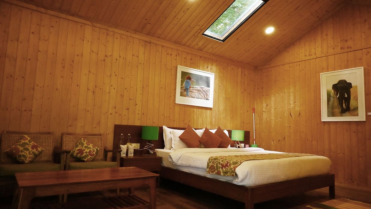 Comfy King size Bed at with a slight opening on the top and a wall painting 