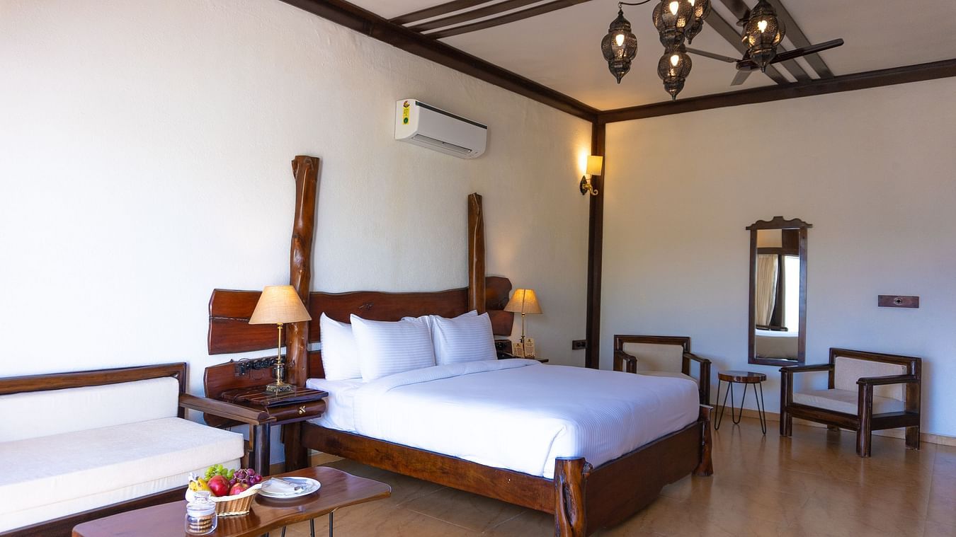 bedroom with white bed covers and other various other amenities at Jagira Ananta Elite