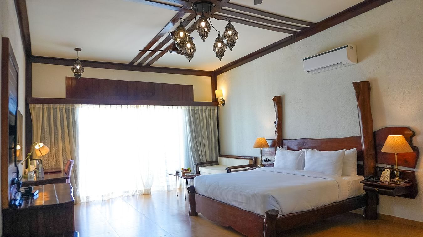 bedroom with white bed covers and other various other amenities at Jagira Ananta Elite 3