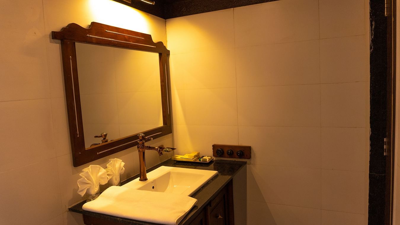 bathroom with warm lighting and modern amenities at Jagira Ananta Elite
