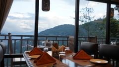 Floor to ceiling windows in restaurant with seating arrangement
