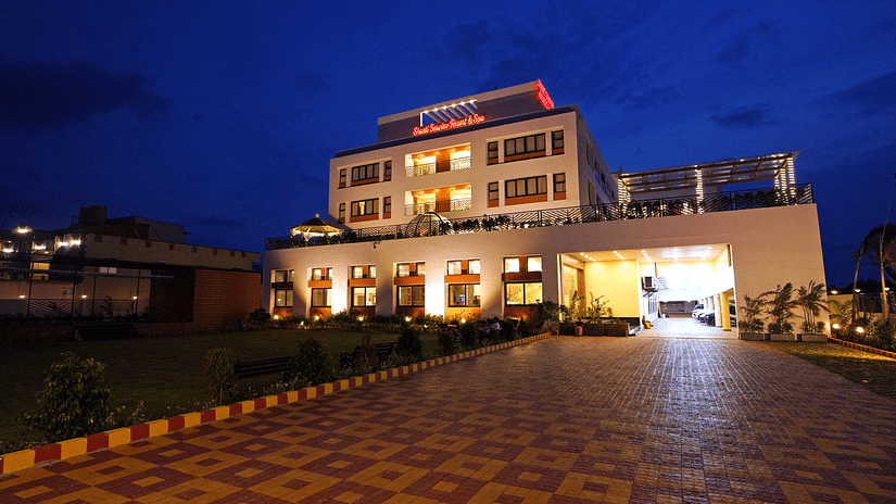 facade of Shanti Seaview Resort & Spa with a pathway leading to the resort - Mandarmani Hotels