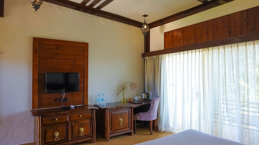 bedroom with various amenities like TV and work desk at Jagira Ananta Elite