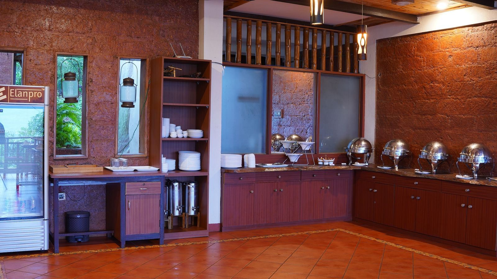 A well-stocked buffet area at Forest Escapes Koyna is ready to serve guests with various culinary options.