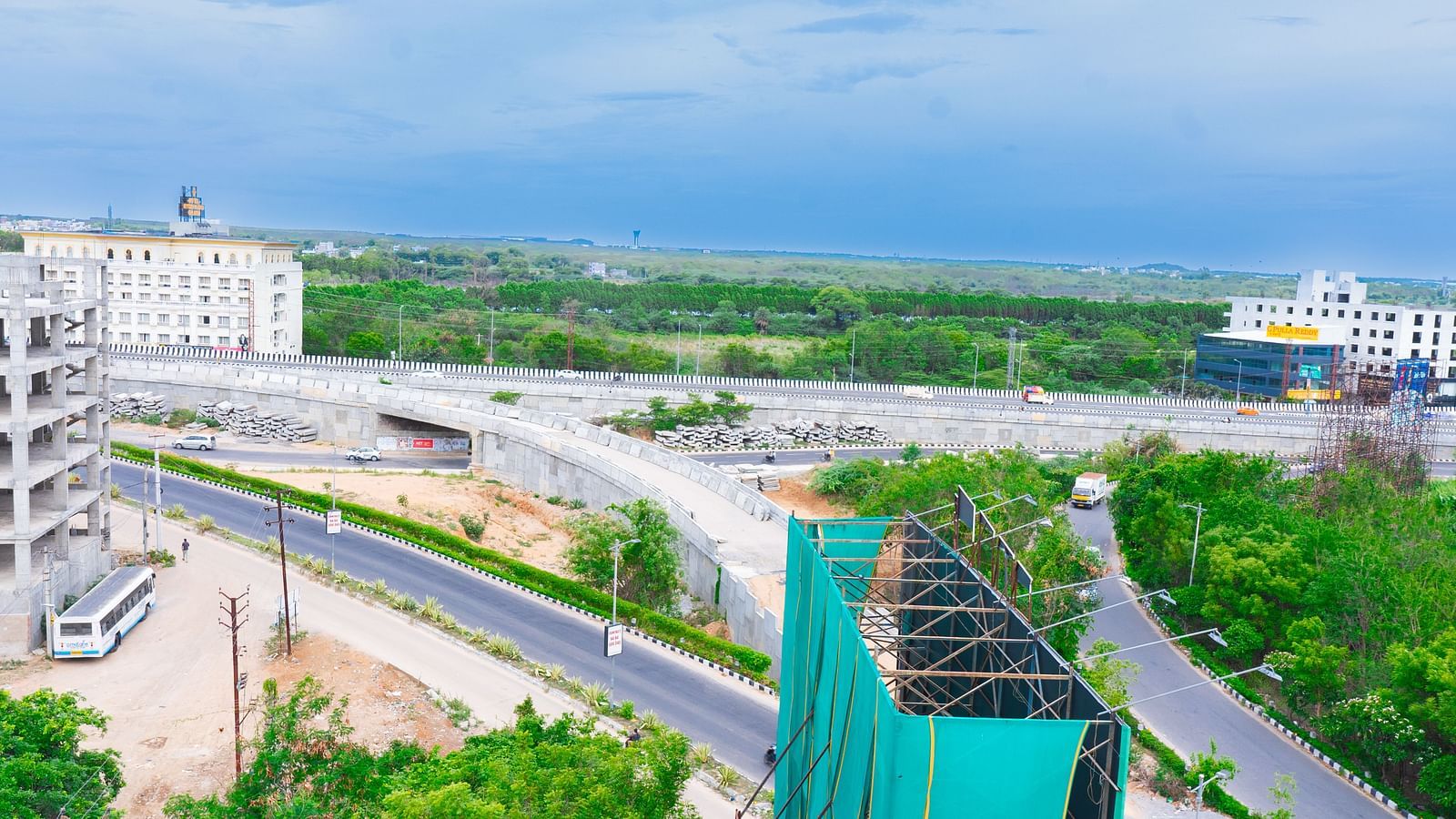 An overview image from a terrace showcasing buildings, roads, and greenaries at a distance - Hotel Aerotel, Hyderabad - A Unit of Comfort Hometel