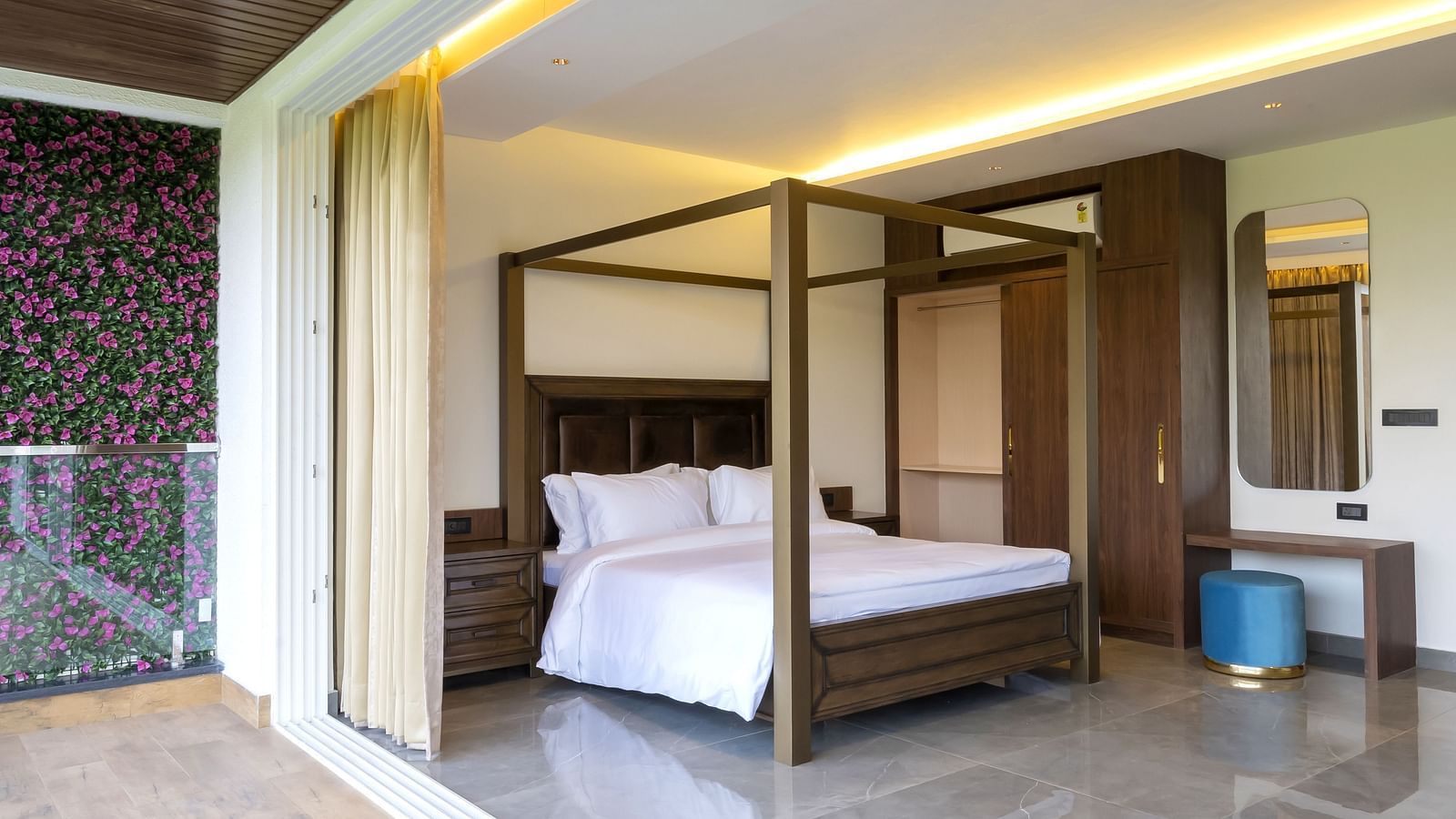A double bed with wooden beams inside one of the rooms - The Tanisi Hotels & Resorts, Goa
