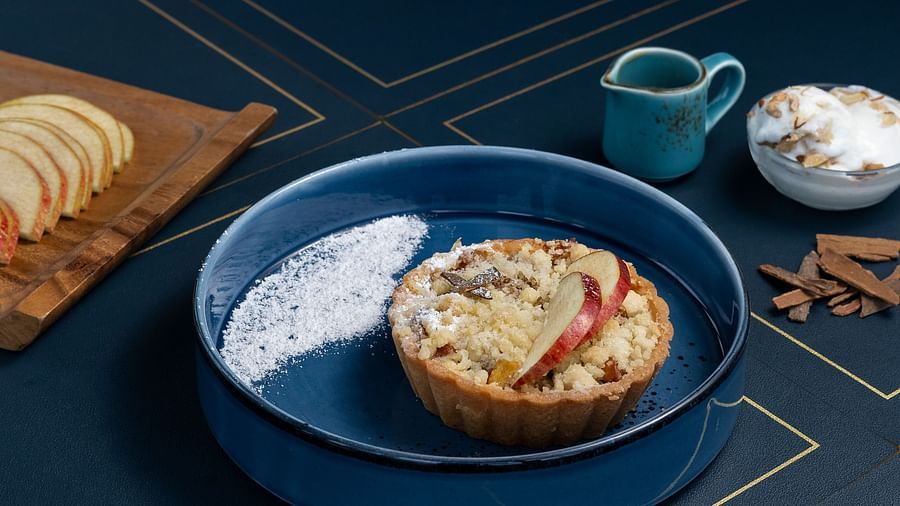 A mouthwatering sweet dish, served in a blue bowl.
