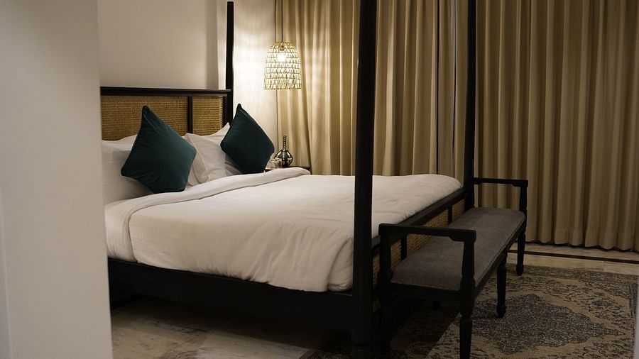 Side view of a room with a bed at Surpura Bagh.
