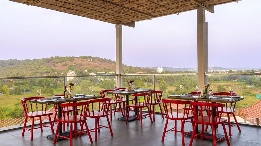 A al fresco seating arrangement inside the in-house restaurant - The Tanisi Hotels & Resorts, Goa