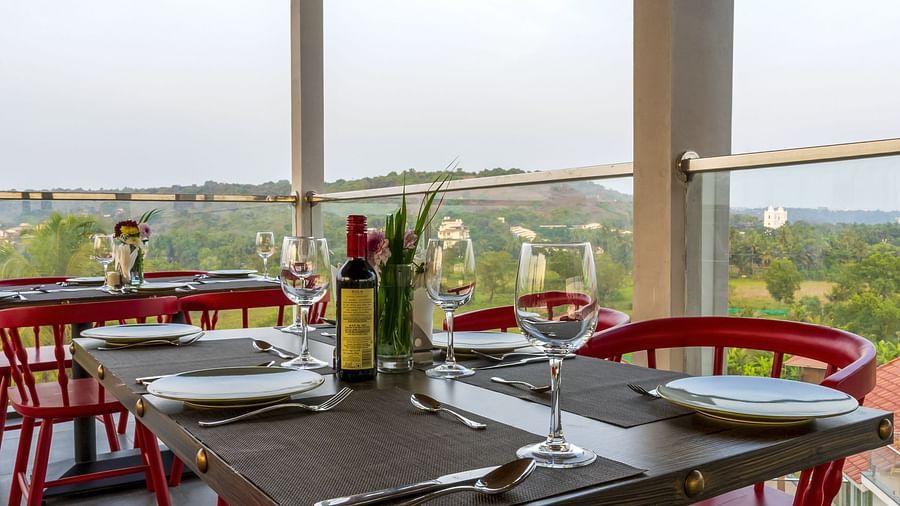 A al fresco seating arrangement inside the in-house restaurant - The Tanisi Hotels & Resorts, Goa