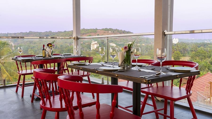 A al fresco seating arrangement inside the in-house restaurant - The Tanisi Hotels & Resorts, Goa