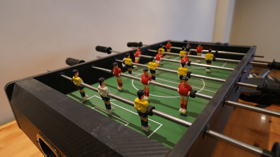Close up of a foosball table with red, and yellow players at Mount Magnolia Boutique Hotel & Spa, Pelling.