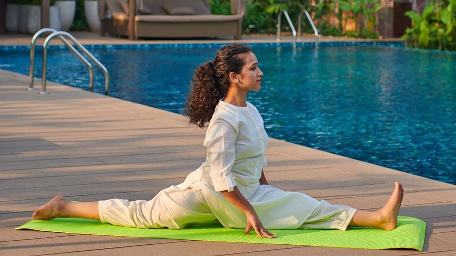 an image of a woman performing yoga with a yoga mat at The Dukes Retreat