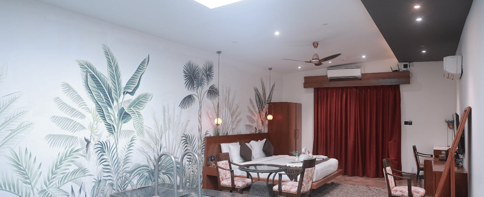 King Room, The in-room pool beneath the skylight, with the bed beyond