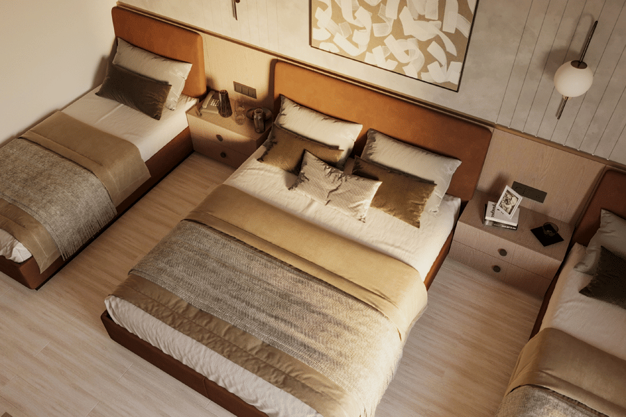 Top view of a family room at Ananta Elite Somnath with multiple beds and spacious layout